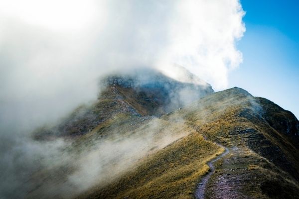 Mountain and foggy path